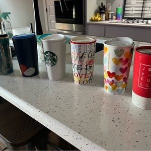 Six ceramic Starbucks cups